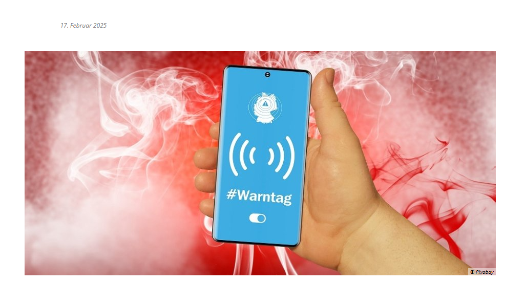 Hand mit Handy. Darauf steht Warntag