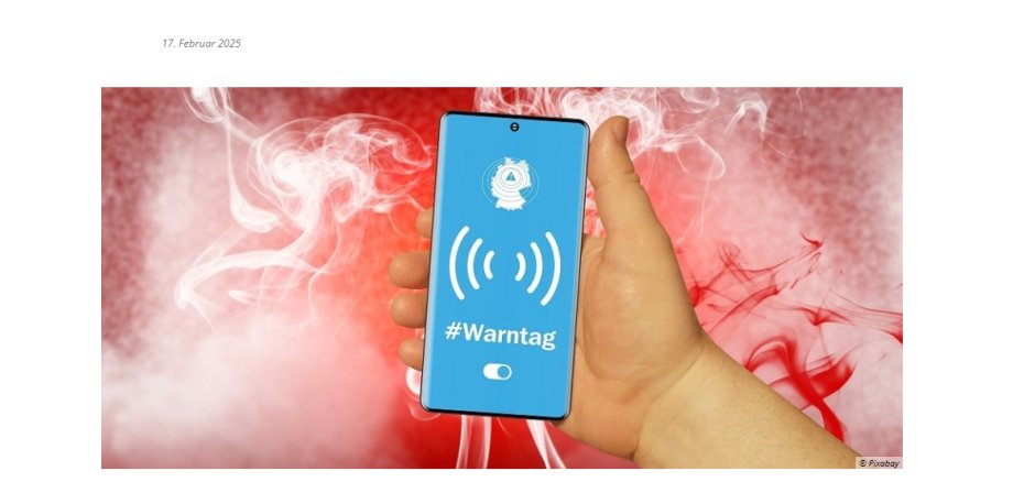 Hand mit Handy. Darauf steht Warntag
